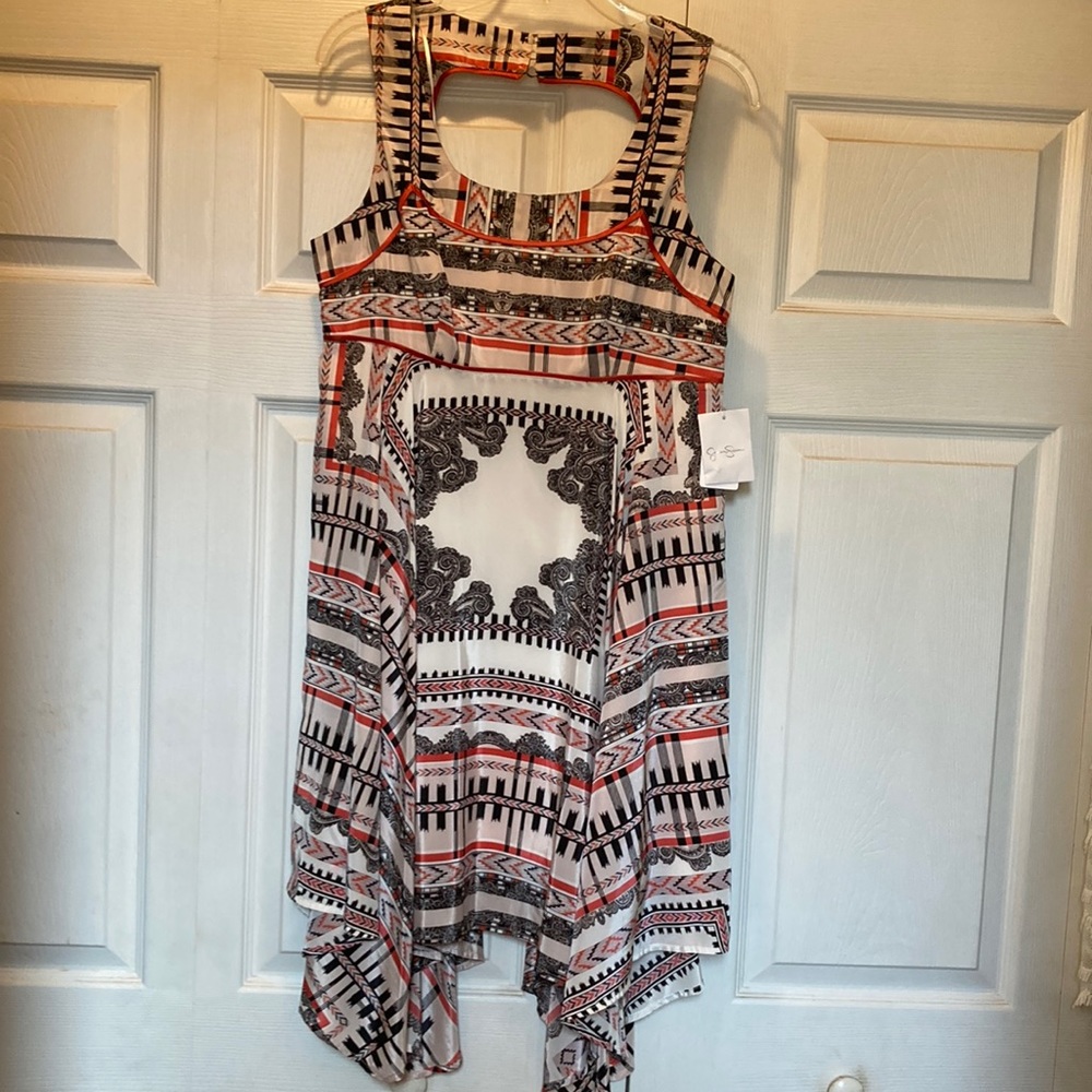 Jessica Simpson dress.. orange, cream and black with tiered bottom..  size 10